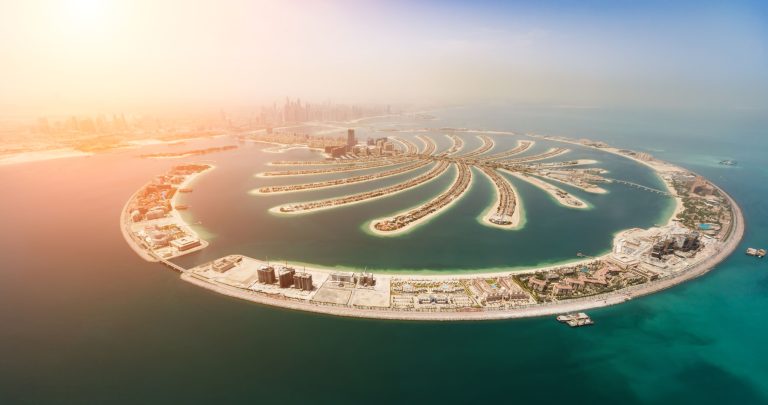 Aerial view of Palm Jumeirah artificial island with luxury beachfront developments in Dubai